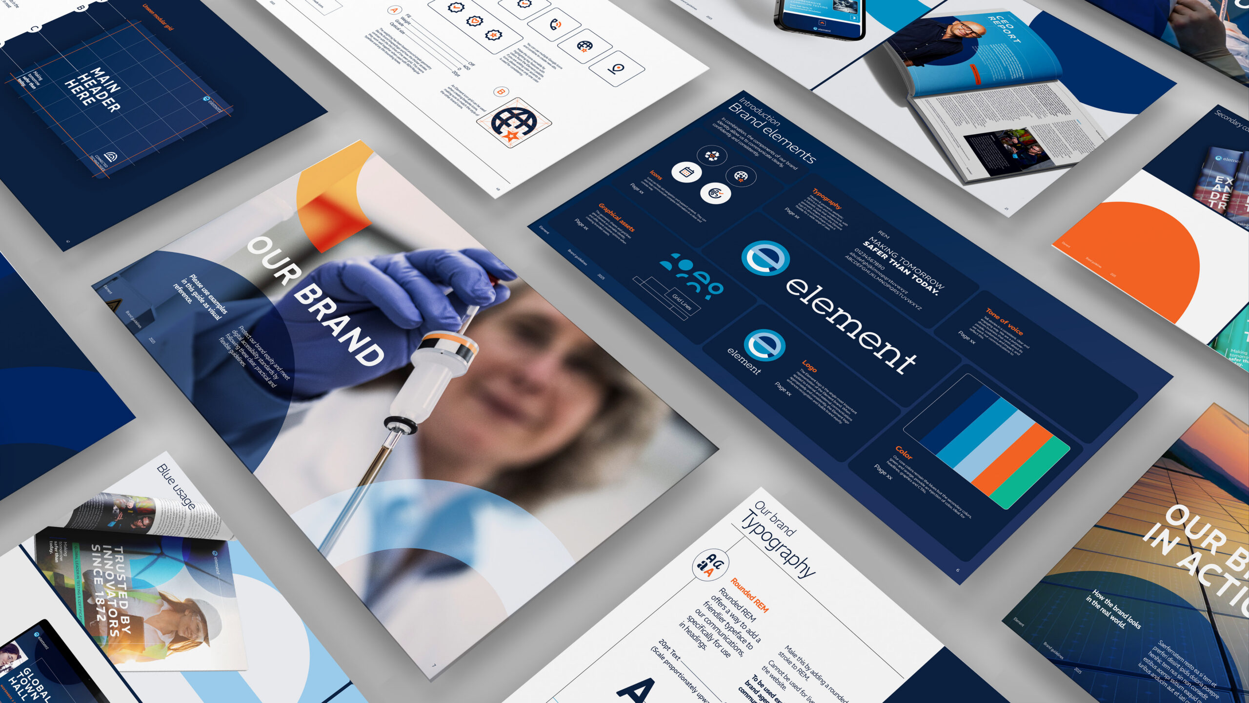 Isometric layout of pages from the Element Brand Guidelines document, showcasing logo usage, color palettes, typography, and image guidelines centered on an 'OUR BRAND' section cover.